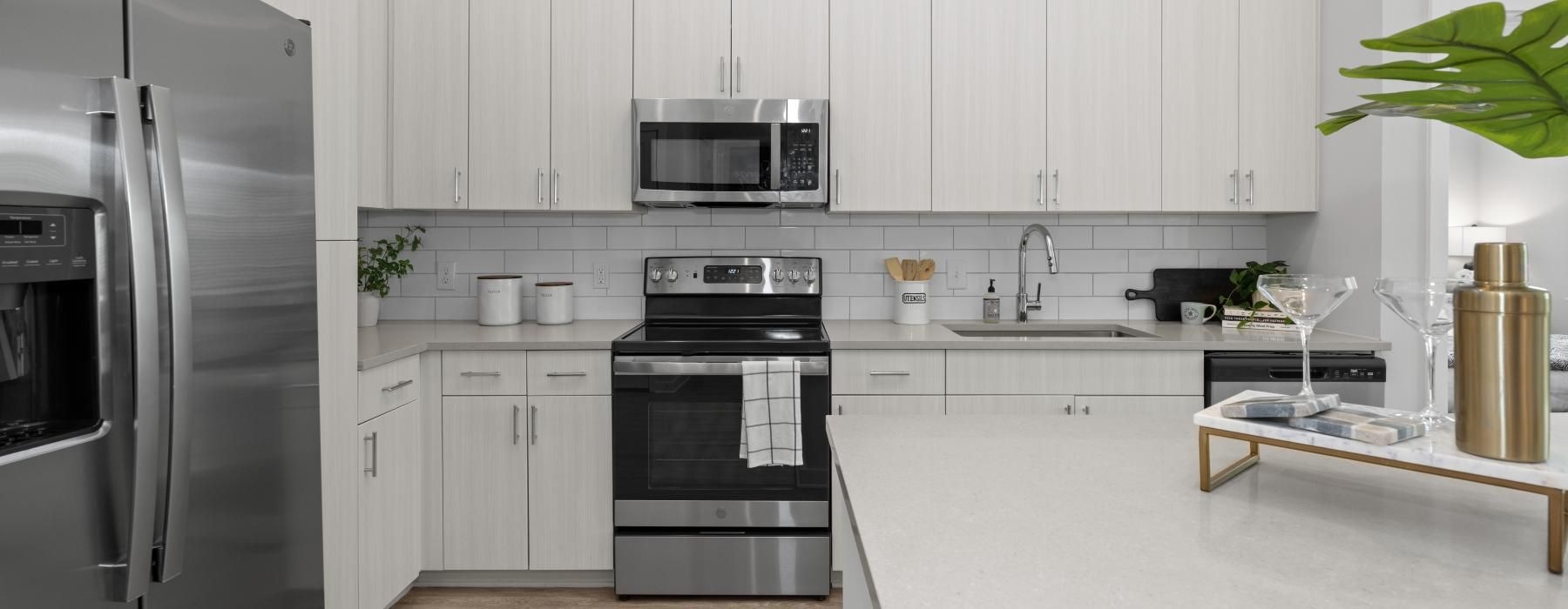 a kitchen with white cabinets
