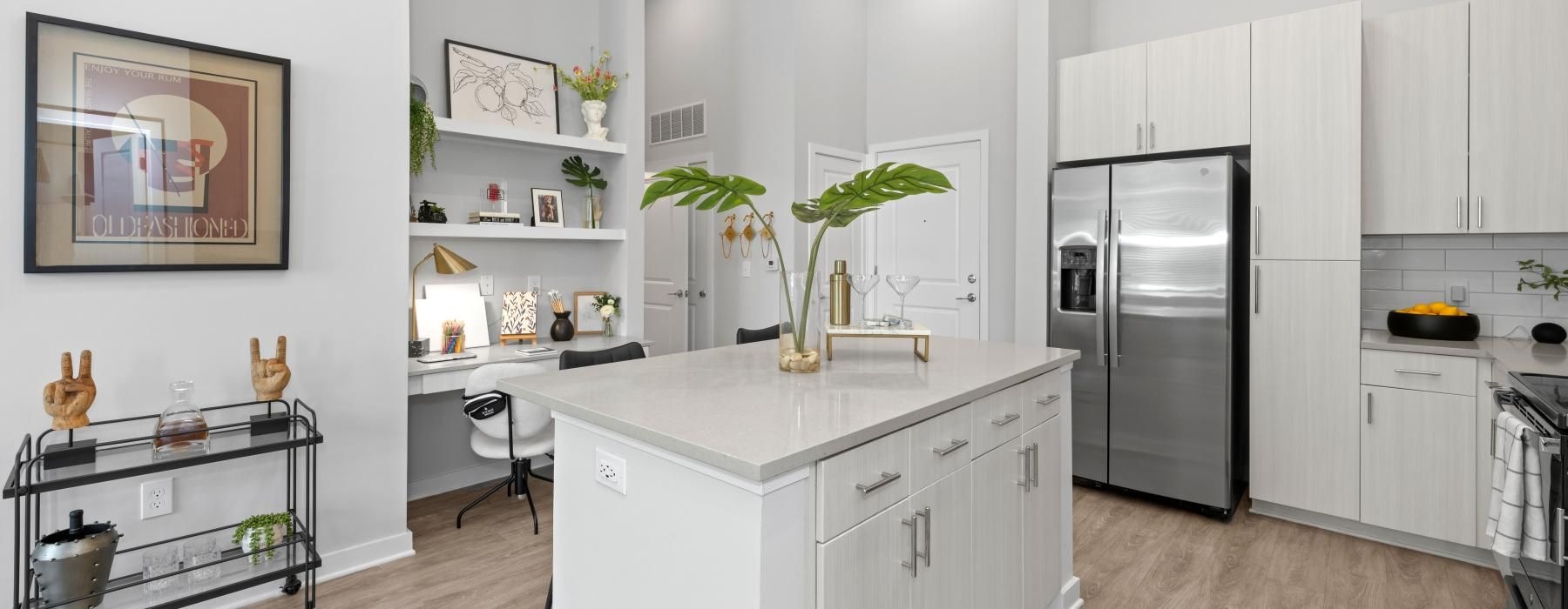 a kitchen with white cabinets
